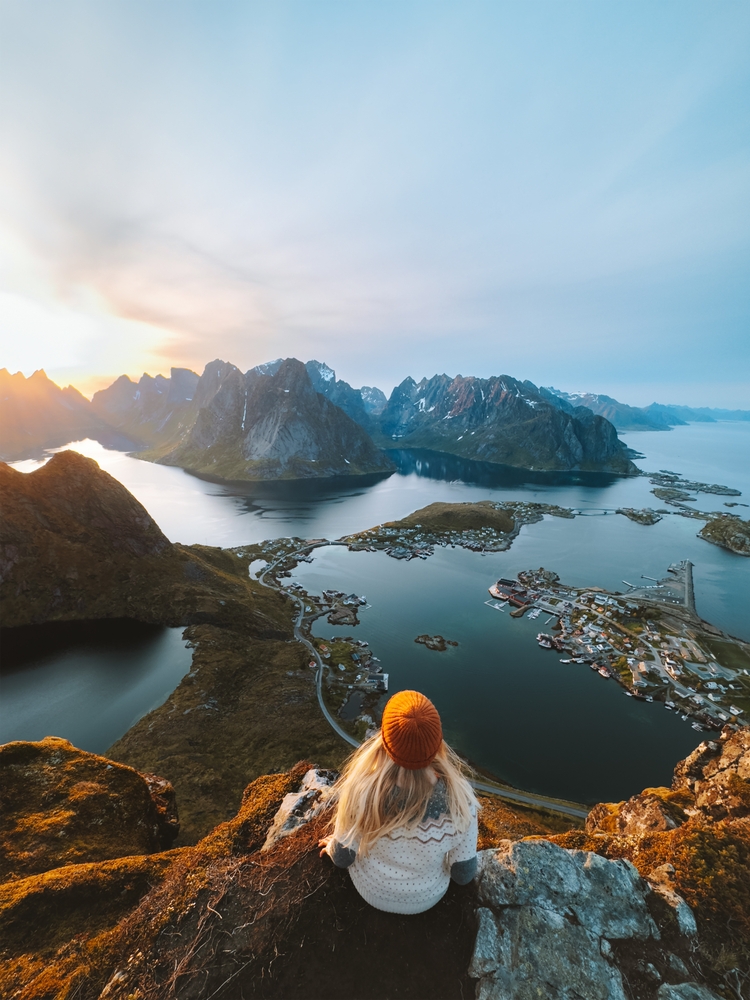 Woman,Traveling,In,Lofoten,Islands,Hiking,Reinebringen,Mountain,,Girl,Enjoying