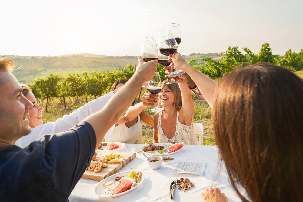 Happy,Adult,Friends,Having,Fun,Drinking,Red,Wine,And,Eating